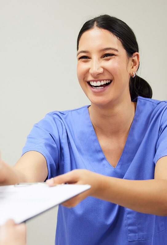 a nurse receiving paperwork